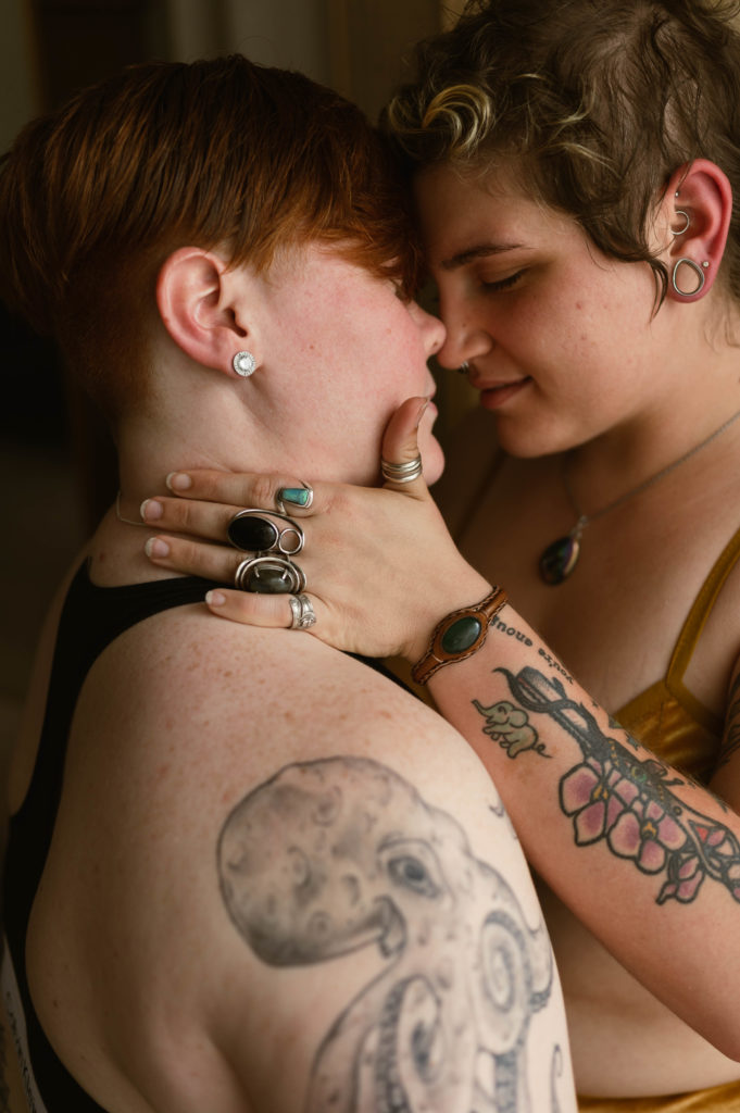 Up close shot of two woman about to kiss at their sensual lifestyle portrait session