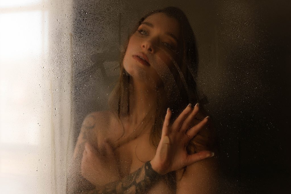 Nude woman in a shower set at a photography studio in Richmond, Virginia.