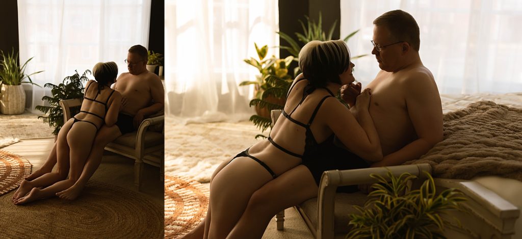 Woman kneeling in front of her man in lingerie for their sexy couples shoot in Virginia. 