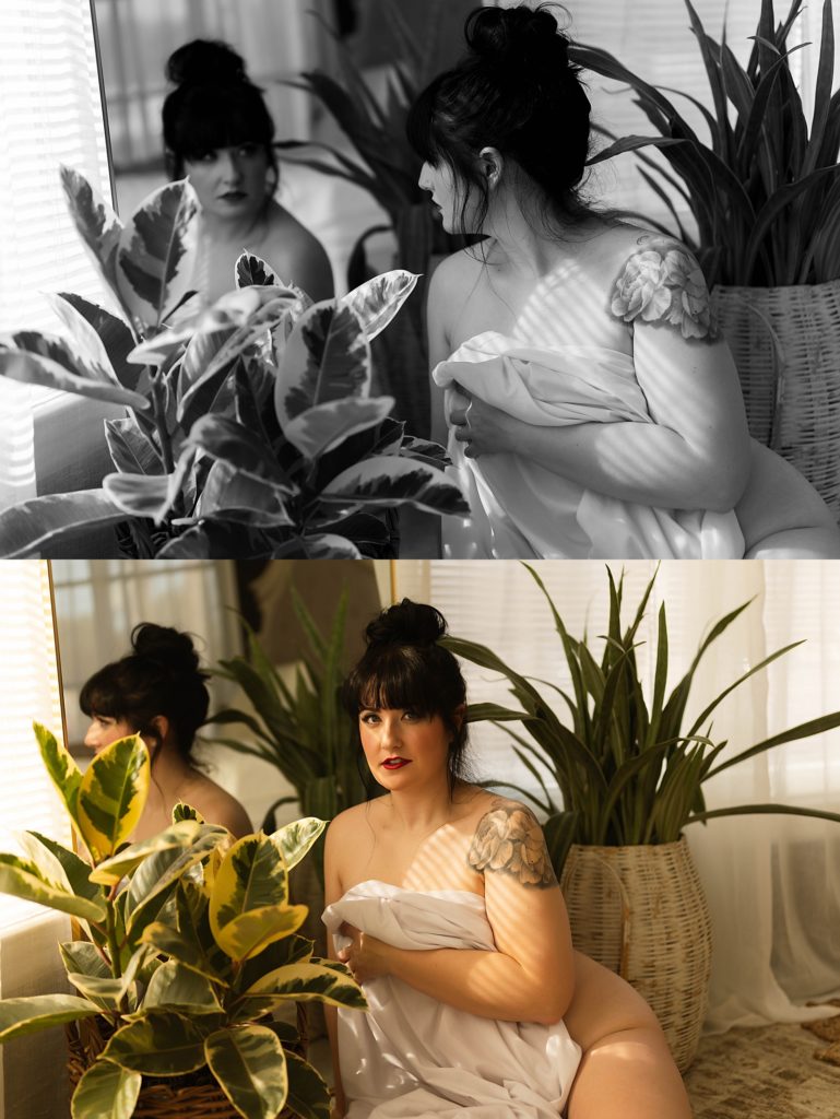 Nude woman wrapped in a sheet sitting on the floor around plants. 