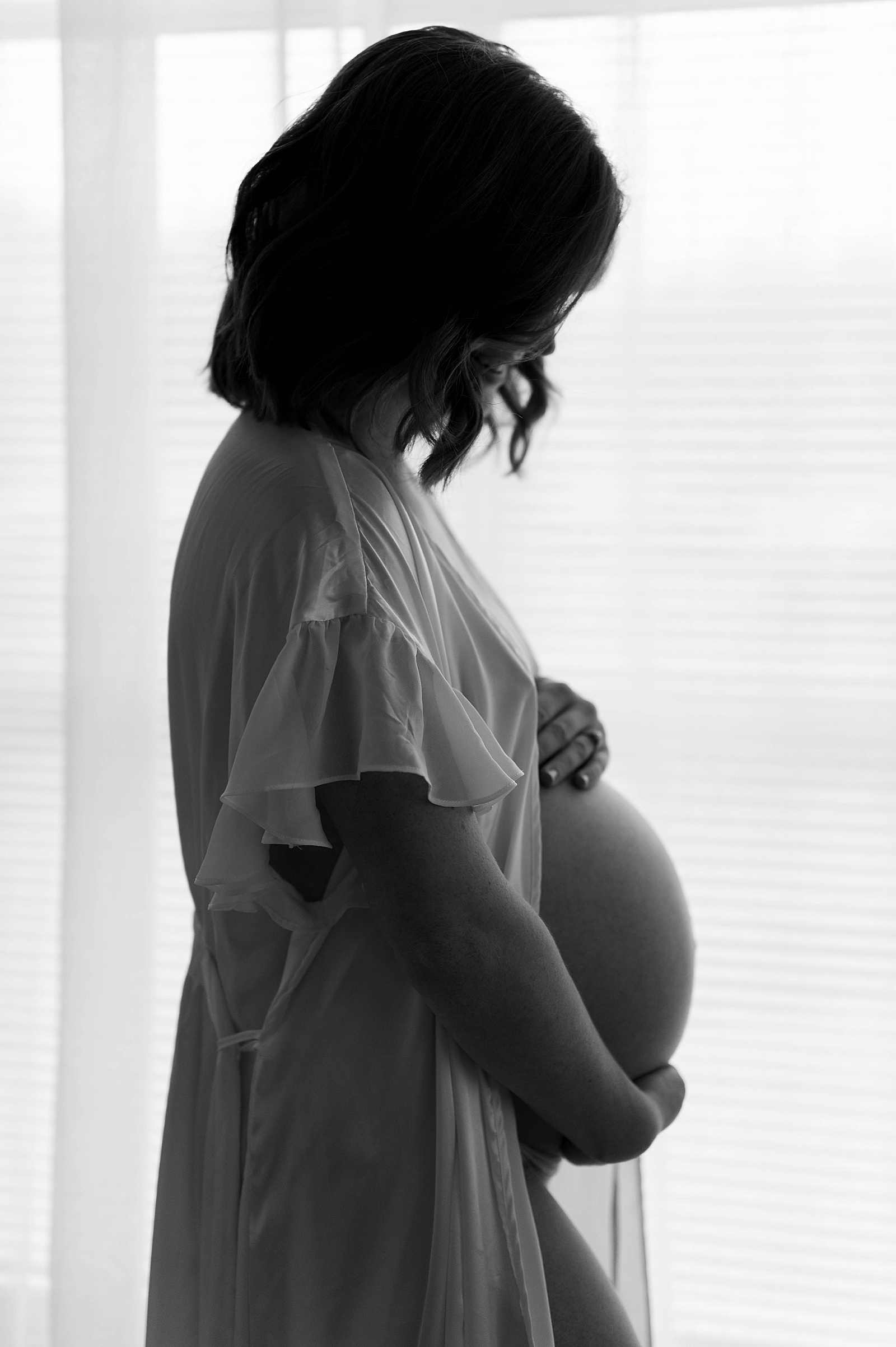 Pregnant woman in the studio with Virginia Boudoir Photographer, Tease by Hannah Louise