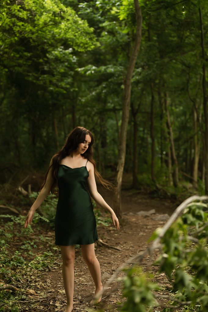 Woman in green slip in the forest by Richmond boudoir photographer, tease by Hannah louise