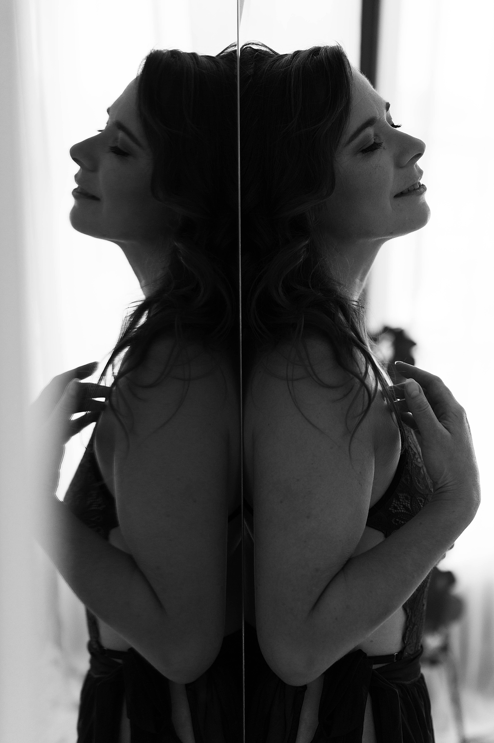 Brunette leaning against a mirror at Richmond studio by Tease by Hannah Louise