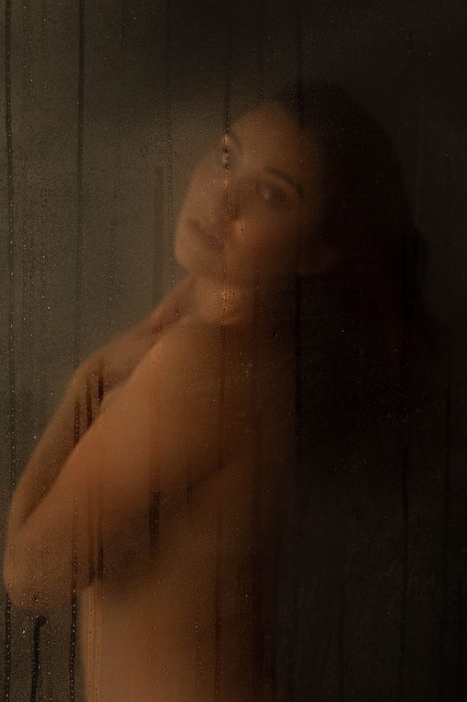 woman in a shower for intimate portrait session