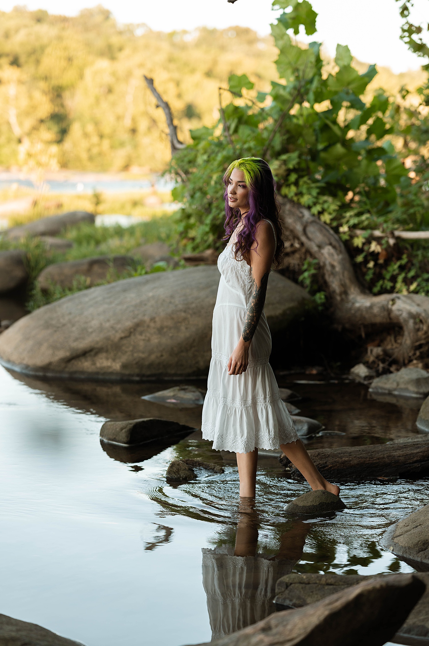 model with green and purple hair walking into water for Fairy Vibes Shoot