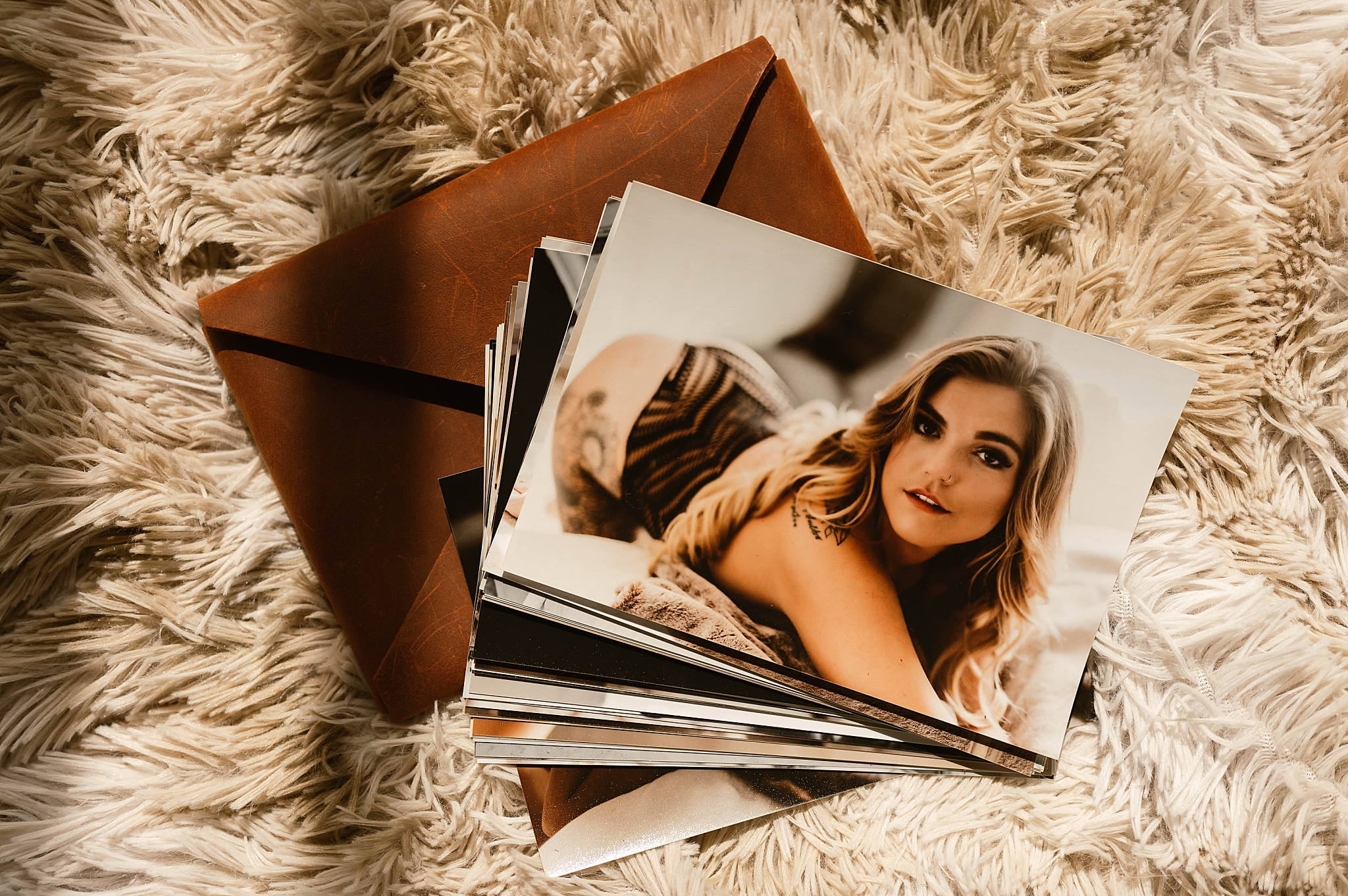 leather envelope with photos by Richmond boudoir photographer